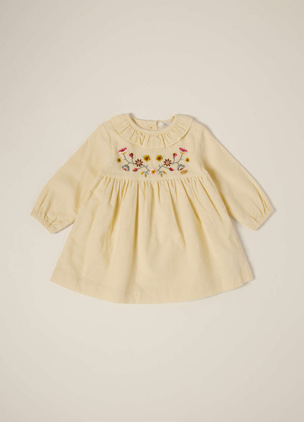 Abito beige in velluto a coste con ricami floreali